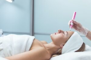 Woman having facial treatment in beauty salon, closeup. Oxy derma therapy